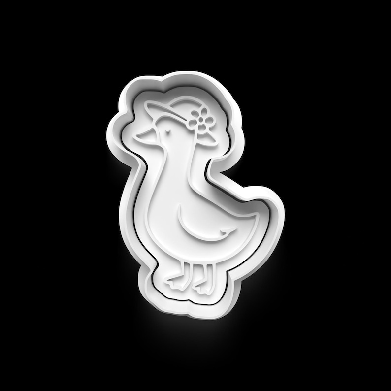 May include: A white plastic cookie cutter in the shape of a duck wearing a hat with a flower. The duck is standing, and the cutter has a thick outline.