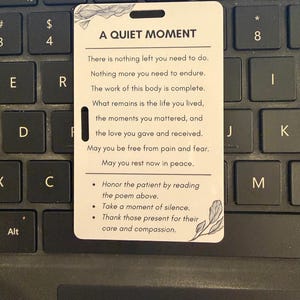 May include: A white card with the text "A Quiet Moment" and a poem about peace and remembrance. The card also includes instructions to honor the patient, take a moment of silence, and thank those present.