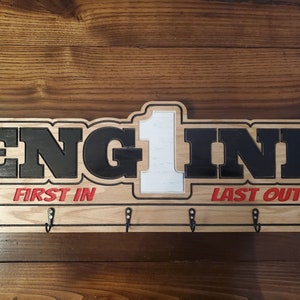 Custom Fire Department Coat Rack, Key Rack, Radio Strap Rack, Bell cap rack. This is a customizable coat rack for a Firefighter.