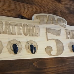 Custom Fire Department Coat Rack, Key Rack, Radio Strap Rack, Bell cap rack. This is a customizable coat rack for a Firefighter, Fire Dept