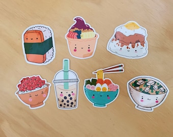 May include: Set of seven colorful stickers featuring various Asian-inspired foods, each with a cute cartoon face. The stickers include a bowl of poke, a bowl of ramen, a bowl of miso soup, a boba tea, a plate of sushi, a bowl of acai, and a plate of loco moco.