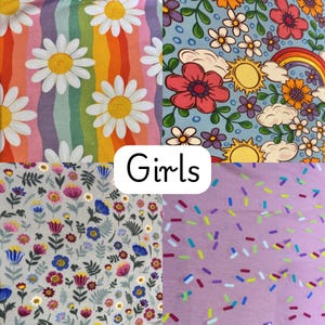 May include: A collage of four fabric patterns. One features large white daisies on a rainbow background. Another has a floral design with a rainbow and sun. The third has small flowers on a gray background. The fourth has colorful sprinkles on a lavender background. The word "Girls" is in the center.