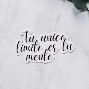 May include: White sticker with black cursive text that reads "Tu unico limite es tu mente".