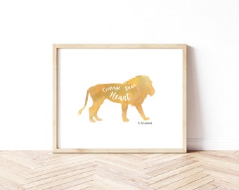 May include: A watercolor print of a lion silhouette with the words "Courage, Dear Heart" and "C.S. Lewis" written below. The lion is a golden yellow color.