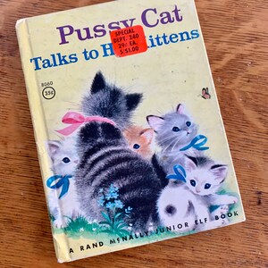 May include: A vintage children's book titled "Pussy Cat Talks to Her Kittens" with a yellow cover and colourful illustrations of kittens. The book is a Rand McNally Junior Elf Book and has a price tag of 35 pence.