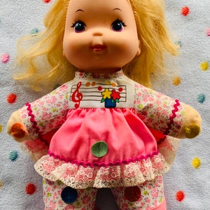Vintage Baby Love Notes Mattel 1974 Squeaker Doll approximately 10” tall. Bubble gum pink and white outfit.