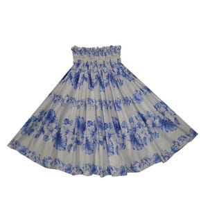 May include: A white maxi skirt with a blue floral print. The skirt has an elastic waistband and a flowing silhouette.