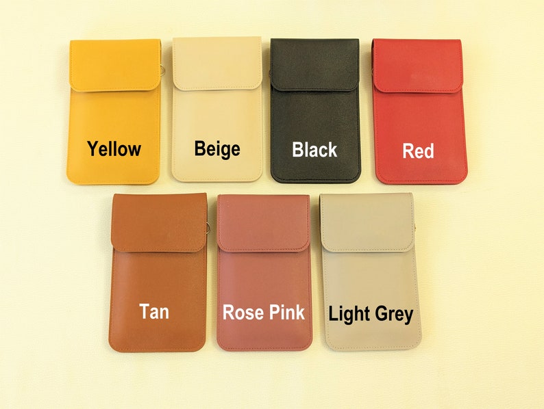 May include: Seven different colored phone pouches with a flap closure. The pouches are in the colors yellow, beige, black, red, tan, rose pink, and light grey. Each pouch has the color name printed on the front.