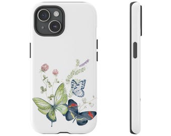 May include: White phone case featuring a watercolor design of butterflies and wildflowers. The design includes a large green butterfly, a blue butterfly, and a black butterfly with red accents. The case has a glossy finish and a black camera housing.