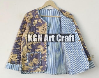 May include: A quilted jacket with a floral print on one side and a blue and white striped pattern on the other side. The jacket has a pocket on the floral side and a button closure. The text "KGN Art Craft" is visible on the jacket.