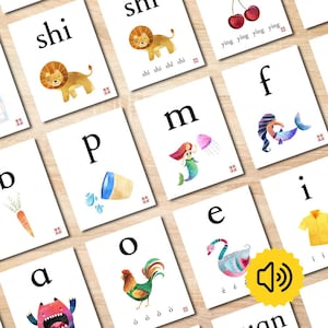May include: A collection of educational flashcards featuring letters of the alphabet paired with watercolor illustrations of a lion, cherries, a mermaid, a jellyfish, a carrot, a cup, a rooster, a swan, and a shirt, with text including shi, ying, p, m, f, b, a, o, e, and i.