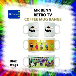 May include: Set of four white ceramic 10oz coffee mugs featuring illustrations from the British children's television show "Mr. Benn". The mugs feature different scenes from the show, including Mr. Benn in his signature top hat and suit, and other characters from the show.