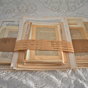 May include: A stack of old, yellowed book pages tied together with brown paper and a label that reads "DIY Book Pages - 100+ Pages - Junk Journal - Mixed Sizes".