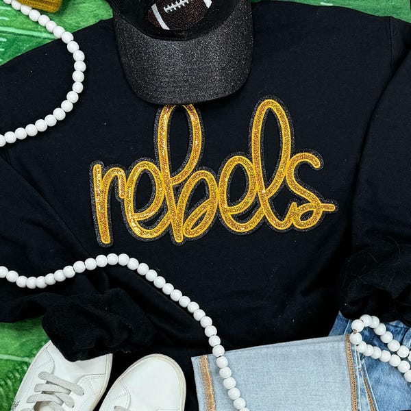 Rebels sweater met paillettenpatch - School Mascot Apparel