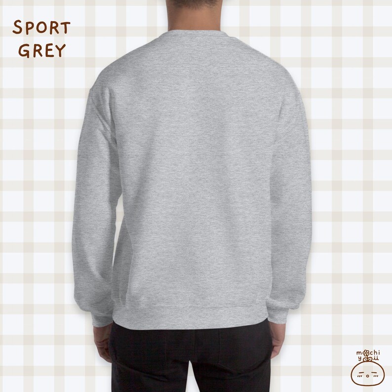 K&ouml;nnte beinhalten: Ein grauer Pullover mit langen &Auml;rmeln. Der Pullover ist aus weichem, bequemem Material und hat eine lockere Passform.