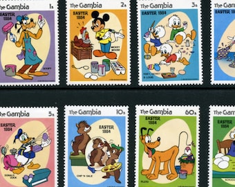 May include: A sheet of postage stamps from The Gambia, featuring Disney characters celebrating Easter in 1984. Goofy paints an egg, Mickey Mouse with a chicken, Huey, Dewey, and Louie decorate eggs, Donald Duck with an egg machine, Chip 'n Dale, and Pluto.