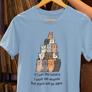 Lottery Winner Cats Tee: Silent Riches & Feline Clues Unisex, Various Colors/Sizes. Funny Gift Shirt for Cat Lovers. image 1