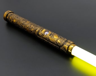 Spada laser dorata caduta Spada laser da duello pesante Spada laser RGB con impugnatura in metallo