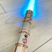 The Gold Smasher M2 Lightsaber Heavy Duelling Lightsaber Metal Hilt RGB Lightsaber with Smooth Swing 