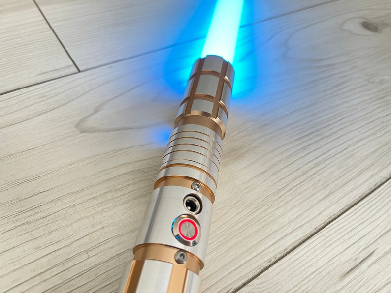 The Gold Smasher M2 Lightsaber Heavy Duelling Lightsaber Metal Hilt RGB Lightsaber with Smooth Swing 