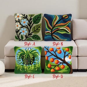 May include: Four square decorative throw cushions with nature-themed designs. Styles include floral, botanical, and fruit tree patterns. Each cushion has a textured, hand-crafted appearance. The cushions are labelled with the text "Style A", "Style B", "Style C", and "Style D".