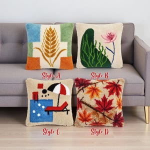 May include: Four decorative throw pillows with different designs. Style A features a wheat stalk, Style B has a flower, Style C shows a pool scene, and Style D displays autumn leaves. Each pillow has the style name printed below it.