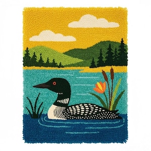 May include: A vibrant, textured wall hanging depicting a loon on a lake. The artwork shows a yellow sky, green hills, and a blue lake. The loon has black and white markings, with an orange eye. A flower and reeds are also present.