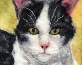 Needle felted picture of a black and white cat