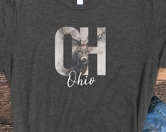 May include: A dark heather grey t-shirt with a white graphic of a deer head inside the letters "CH" and the word "Ohio" underneath.