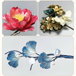 May include: A collection of three decorative hair accessories. The top left features a large red and yellow flower. The top right shows a floral arrangement with butterflies. The bottom shows a blue and gold leaf branch with pearls.