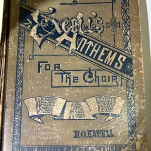 May include: A vintage book cover with a gold background and blue lettering. The title is "Excel's Anthems For The Choir". The cover lists contributors and the price as "900 Per Doz Each By Mail".