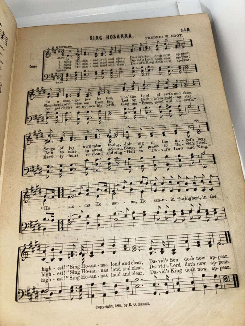May include: A vintage sheet music book with the title "Sing Hosanna" by Fredric W. Root. The music is written in black ink on a cream-colored paper. The sheet music is for a song about the birth of Jesus Christ.