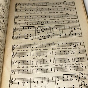 May include: A black and white sheet music page with the title "I Will Praise Thee" and the lyrics "Thou hast maintained my right and my cause." The music is written in a traditional style with notes and clefs.