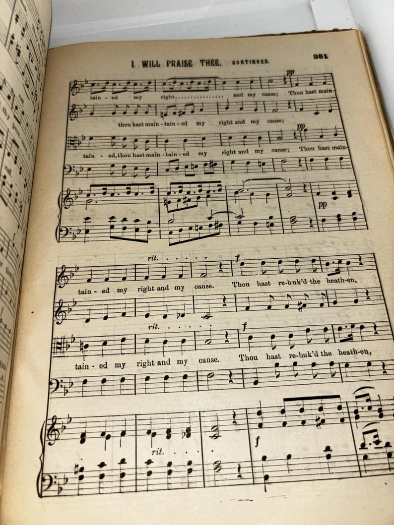 May include: A black and white sheet music page with the title "I Will Praise Thee" and the lyrics "Thou hast maintained my right and my cause." The music is written in a traditional style with notes and clefs.