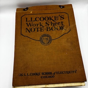 May include: A brown notebook with the text "L.L. COOKE'S Work Sheet NOTE BOOK" and "The L.L. COOKE SCHOOL of ELECTRICITY CHICAGO" printed on the front cover.