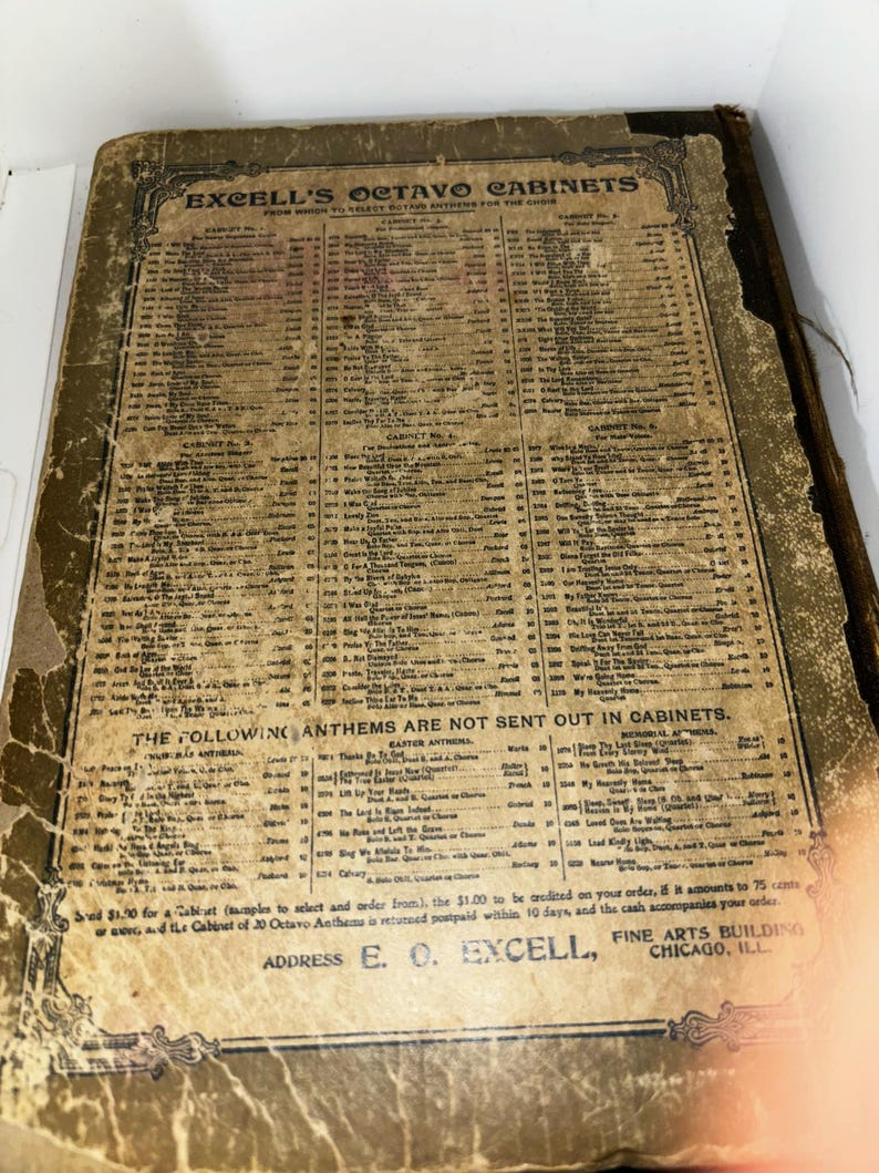 May include: A vintage, brown, paper-covered book with the title "Excell's Octavo Cabinets" printed on the front cover. The book lists a variety of anthems and hymns, with a price list and address for ordering.