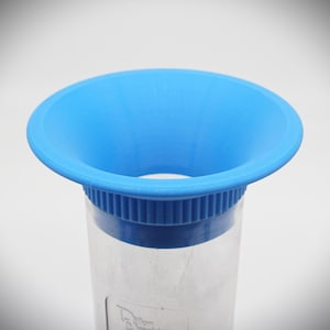 May include: A blue plastic funnel with a clear plastic cylinder attached to the bottom. The funnel has a wide opening and a narrow spout.