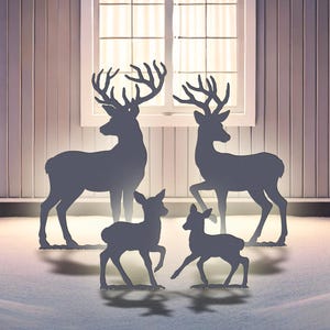 May include: Silhouette metal deer family art. The image shows two adult deer and two fawns in front of a house. The text on the image says "PDF File: US Letter / A4 Prints" and "AI, CDR, DWG, DXF, SVG: CNC / Laser Cutting".