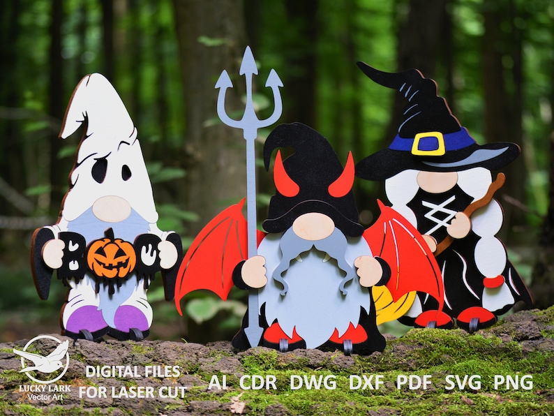 May include: Four Halloween gnomes, each dressed in a different costume. A ghost gnome holds a pumpkin and says "Boo". A devil gnome holds a pitchfork. A witch gnome holds a broom. A vampire gnome holds a bat.