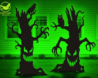 May include: Two black silhouette tree cutouts with jagged, glowing green eyes and mouths. The left tree features a perched crow, while the right tree displays an owl. Both trees have twisted, claw-like branches against a bright green background.