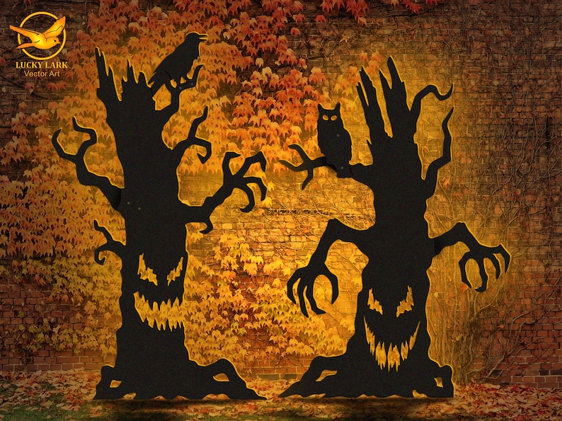 May include: Two black silhouette tree cutouts with jagged, glowing yellow eyes and mouths. The left tree features a perched raven, while the right tree displays an owl on a branch. Both trees have twisted, claw-like branches and roots.