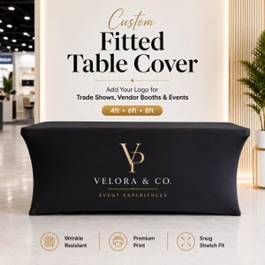 May include: A black fitted table cover featuring the gold logo for Velora & Co. Event Experiences. The text above reads Custom Fitted Table Cover, Add Your Logo for Trade Shows, Vendor Booths & Events, and 4ft, 6ft, 8ft. Icons indicate wrinkle resistant, premium print, and snug stretch fit.