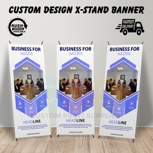 May include: A white and blue banner with the text "Business for Success" and a photo of a group of people sitting at a table. The banner is designed for a retractable x-stand.