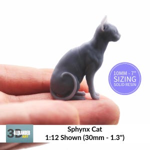 May include: A grey Sphynx cat figurine, approximately 3cm long, made of solid resin. The cat is depicted in a seated pose with its tail curled. The image includes text that says "10MM - 7" SIZING SOLID RESIN" and "Sphynx Cat 1:12 Shown (30mm - 1.3")".