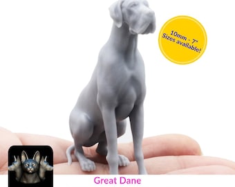 May include: A grey 3D printed Great Dane dog figurine sitting on a hand. The figurine is 60mm tall and is available in sizes from 10mm to 7 inches.