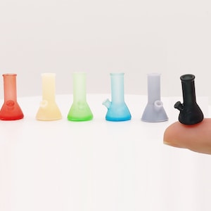 May include: Set of six miniature glass bongs in various colors, including red, yellow, green, blue, gray, and black.