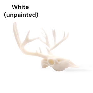 May include: White, unpainted deer skull with antlers. The skull is made of a smooth, white material and has a realistic appearance.