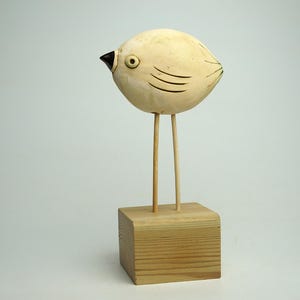 Handmade Ceramic Bird Figurine: Silver Glaze, Wooden Legs