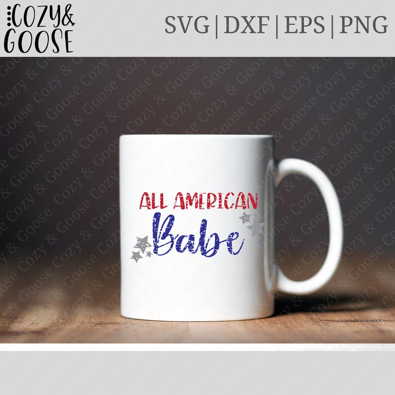 May include: White ceramic mug with a red, white, and blue design. The text "ALL AMERICAN Babe" is written in a stylized font with stars around the text.