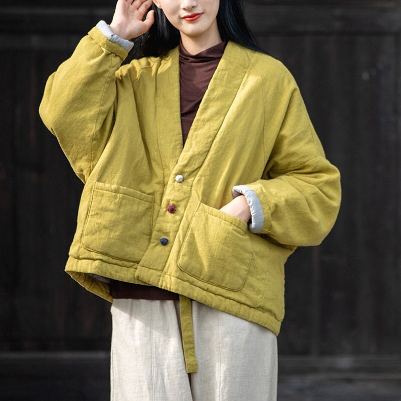 winter coat with yellow strap